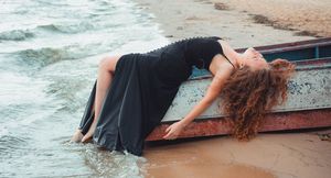 Silicone Free Hair Oil - Women with ginger curly hair on a boat